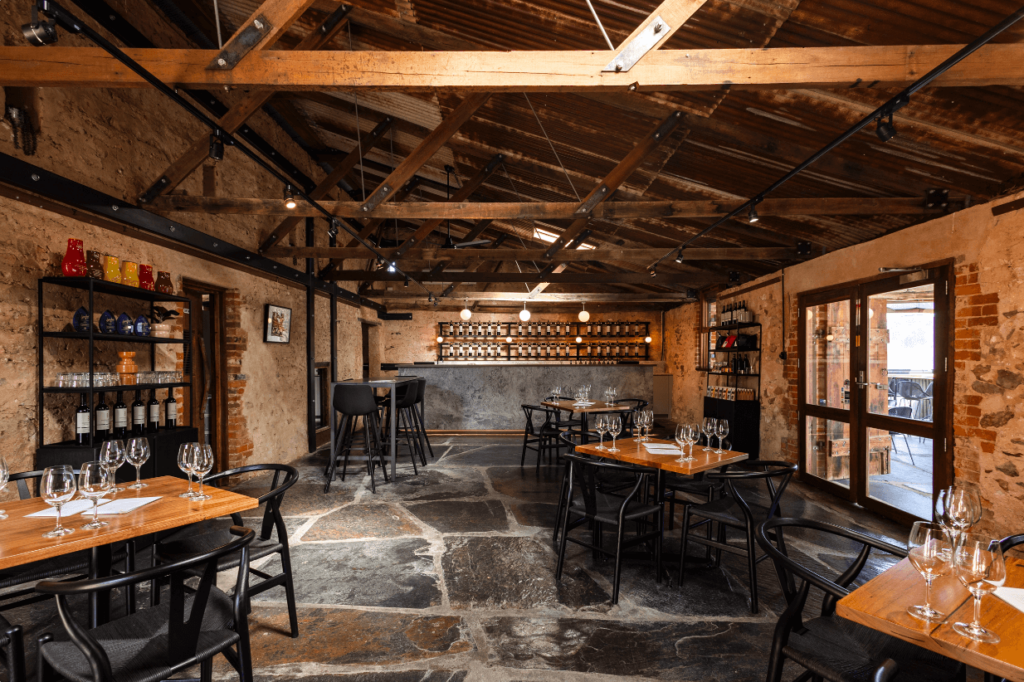 Rustic timber and natural colour palette, exposed timber structure beams and exposed brick walls for this commercial hospitality fit out for Shingleback Winery